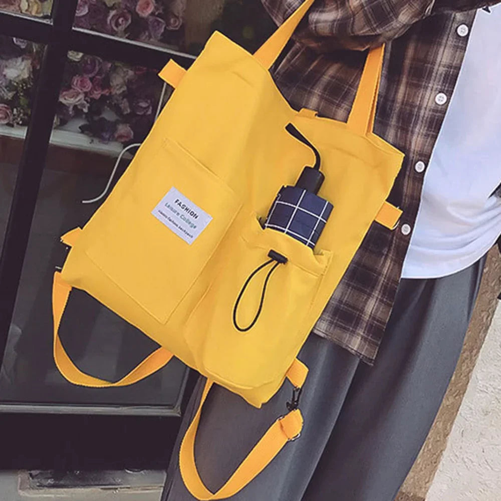 The tote carried by the short top handles in Yellow