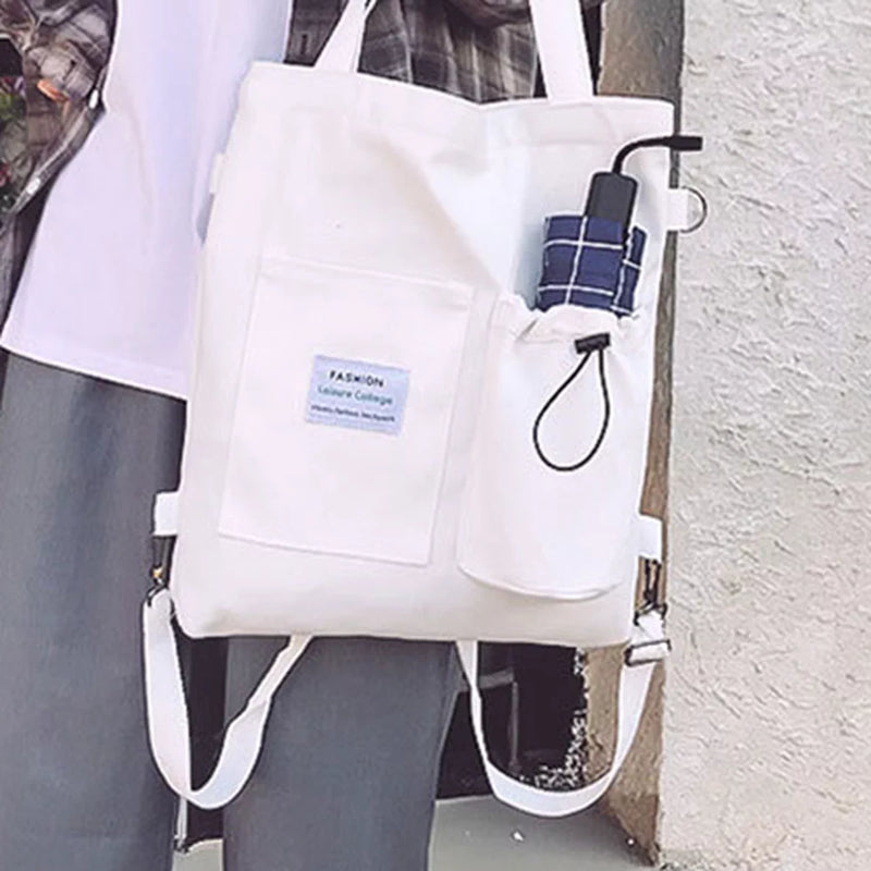 The same tote worn on the shoulder