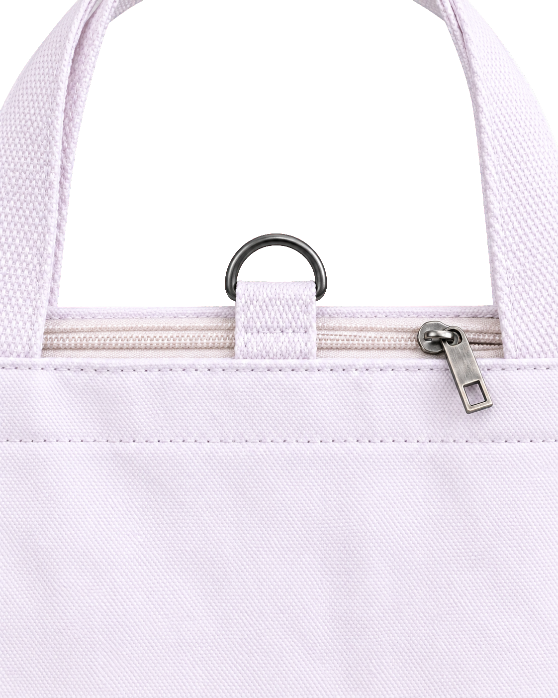 Close-up of the metal ring on the canvas tab at the top center of the white tote, between the two handles, above the closed zipper and its silver pull